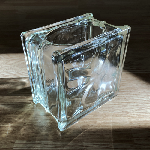 Photo: glass block with a hole on one side