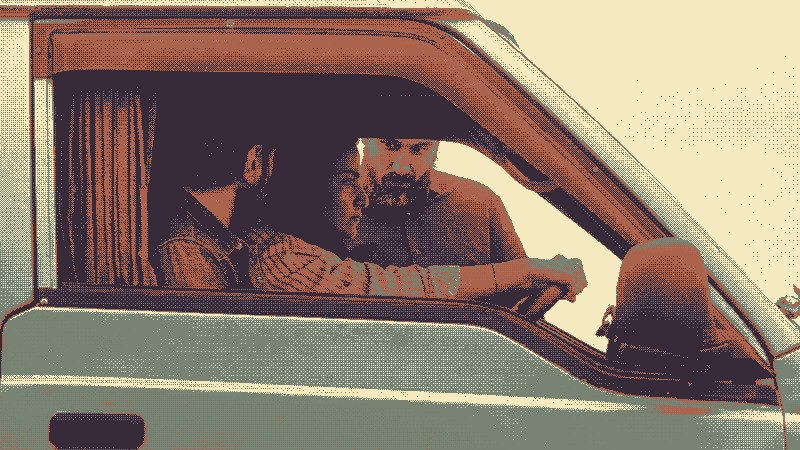 Bahar, driving a van, is confronted by the police