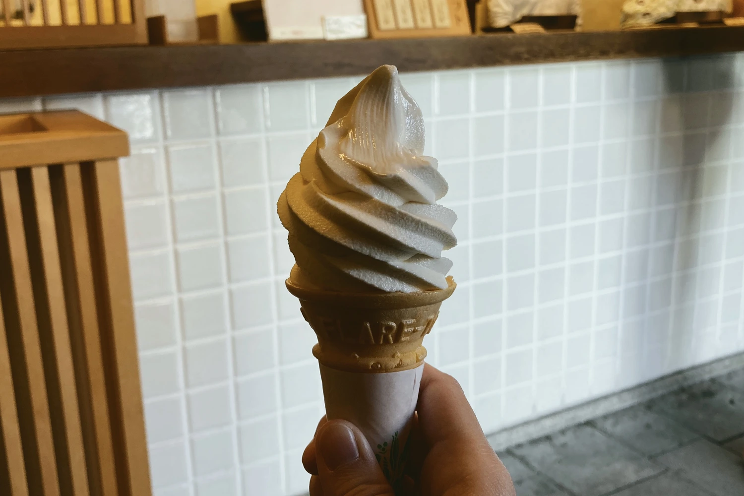 white soft serve in a wafer cone